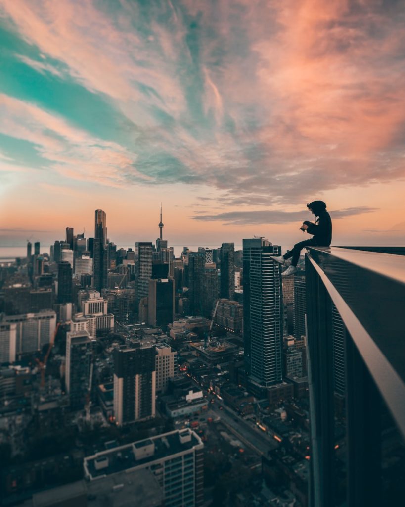 person sitting on top of the building